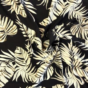 Tissu viscose / polyamide - Feuilles tropicales sur fond noir