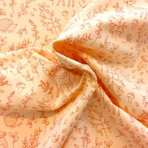 Tissu jersey - animaux de la forêt sur fond orange pâle - Poppy